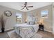 Comfortable bedroom with modern lighting and plenty of natural light at 239 W Jamison Ct, Littleton, CO 80120