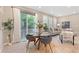 Dining area featuring a modern table, chairs, and sliding doors to outdoor space at 239 W Jamison Ct, Littleton, CO 80120