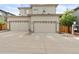 Attached two-car garage with contemporary doors, driveway, and neutral siding at 239 W Jamison Ct, Littleton, CO 80120