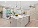 Spacious kitchen featuring a large island, modern fixtures, and an open design at 239 W Jamison Ct, Littleton, CO 80120