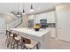 Beautiful kitchen with a large island, modern lighting, and stainless steel appliances at 239 W Jamison Ct, Littleton, CO 80120