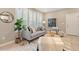Bright living room with large windows, modern furniture, and stylish decor at 239 W Jamison Ct, Littleton, CO 80120