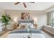 Bedroom featuring a decorative wall art and a large area rug at 239 W Jamison Ct, Littleton, CO 80120