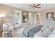 Open bedroom with decorative wall art and a seating area with a decorative rug at 239 W Jamison Ct, Littleton, CO 80120
