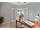 Office space with French doors leading to a dining area at 239 W Jamison Ct, Littleton, CO 80120
