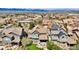 Panoramic aerial view showcasing a neighborhood of houses with well-maintained landscaping and mountain views at 10492 Willowwisp Way, Highlands Ranch, CO 80126