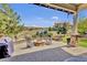 Backyard patio with fire pit and outdoor seating overlooking scenic views and green space at 10492 Willowwisp Way, Highlands Ranch, CO 80126