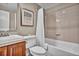 Well-lit bathroom with a tiled shower/tub combination, a modern vanity, and a clean, functional design at 10492 Willowwisp Way, Highlands Ranch, CO 80126