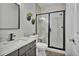 Contemporary bathroom featuring black framed shower, floating planter decor, and modern fixtures at 10492 Willowwisp Way, Highlands Ranch, CO 80126