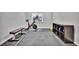 Functional home gym with workout equipment, rubber flooring, weight rack, and natural light from a window at 10492 Willowwisp Way, Highlands Ranch, CO 80126
