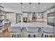 Modern kitchen featuring an oversized island, stainless steel appliances, and sleek cabinetry at 10492 Willowwisp Way, Highlands Ranch, CO 80126