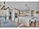 Contemporary kitchen with a large island, pendant lighting, and stainless steel appliances at 10492 Willowwisp Way, Highlands Ranch, CO 80126