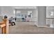 Open loft area featuring neutral carpet, bright walls, and plentiful windows at 10492 Willowwisp Way, Highlands Ranch, CO 80126