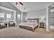 Spacious main bedroom features sitting area, large windows, and access to the ensuite at 10492 Willowwisp Way, Highlands Ranch, CO 80126