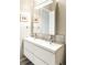 Modern bathroom with double vanity, sleek white cabinets and contemporary fixtures at 336 E 1St Ave # 209, Denver, CO 80203