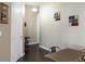 Cozy dining area with table, chairs, and artwork, adjacent to a hallway at 336 E 1St Ave # 209, Denver, CO 80203
