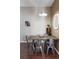 Stylish dining room with seating for four, modern light fixture, and adjacent to a wine storage cabinet at 336 E 1St Ave # 209, Denver, CO 80203