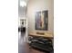 Entryway with art, console table, and a view into a modern living space at 336 E 1St Ave # 209, Denver, CO 80203