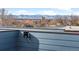 Modern roof deck speaker with panoramic city and mountain views at 336 E 1St Ave # 209, Denver, CO 80203