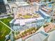 Stunning aerial view showcasing a modern building with rooftop garden and downtown cityscape at 55 W 12Th Ave # 512, Denver, CO 80204
