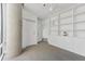 Inviting bedroom with custom built-in shelving, carpet flooring and a floor to ceiling window at 55 W 12Th Ave # 512, Denver, CO 80204