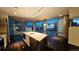 Contemporary kitchen boasts stainless steel appliances, a marble countertop island, and stunning cityscape views through large windows at 55 W 12Th Ave # 512, Denver, CO 80204