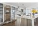Modern kitchen with stainless steel appliances, a large island, a wine fridge, and white cabinetry at 55 W 12Th Ave # 512, Denver, CO 80204