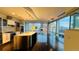 Spacious kitchen with stainless steel island, modern appliances, and floor-to-ceiling windows with city views at 55 W 12Th Ave # 512, Denver, CO 80204