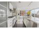 Sleek, modern kitchen with stainless steel appliances and marble countertops, featuring large windows and city views at 55 W 12Th Ave # 512, Denver, CO 80204