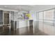 Bright open kitchen with stainless island, floor-to-ceiling windows, and modern appliances at 55 W 12Th Ave # 512, Denver, CO 80204