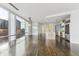 Bright, open-concept living room with hardwood floors, large windows offering city views, and modern lighting at 55 W 12Th Ave # 512, Denver, CO 80204