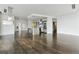 Open concept living space with hardwood floors, modern lighting, stainless steel kitchen island, and bright, airy ambiance at 55 W 12Th Ave # 512, Denver, CO 80204