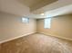 Cozy basement featuring new carpet, neutral paint, and natural light at 2274 S Newton St, Denver, CO 80219