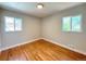 Bright bedroom featuring hardwood floors, neutral paint and abundant natural light at 2274 S Newton St, Denver, CO 80219