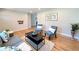 Bright and open living room with hardwood floors, natural light, and a comfortable seating arrangement at 2274 S Newton St, Denver, CO 80219