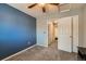 A secondary bedroom features an en-suite bathroom and a spacious closet at 2900 Purcell St # I4, Brighton, CO 80601