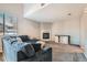 Cozy living room featuring a fireplace and a large comfortable sectional couch with lots of pillows at 2900 Purcell St # I4, Brighton, CO 80601