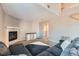 Spacious living room with plush seating, fireplace, and ample natural light at 2900 Purcell St # I4, Brighton, CO 80601