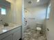 Well-lit bathroom with a tub-shower and vanity at 586 Nightsky St, Erie, CO 80516