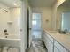 Bathroom with tub, vanity, and stylish tile at 586 Nightsky St, Erie, CO 80516