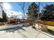 Landscaped backyard with patio and fire pit at 16357 E Wyoming Dr, Aurora, CO 80017