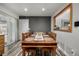 Dining area with a large wooden table and access to the kitchen at 16357 E Wyoming Dr, Aurora, CO 80017