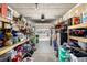 Organized garage with storage and shelving at 16357 E Wyoming Dr, Aurora, CO 80017