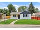 Charming single-story home features a well-manicured lawn and inviting walkway at 851 S Eliot St, Denver, CO 80219