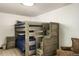 Rustic bedroom featuring a wooden bunk bed with convenient built-in steps and adjacent nightstand at 610 Meadow View Dr, Evergreen, CO 80439