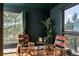 Cozy reading nook with chairs and a table offers scenic views of the surrounding landscape at 610 Meadow View Dr, Evergreen, CO 80439