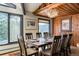 Dining room features a wood table, chairs, and a mountain view window at 610 Meadow View Dr, Evergreen, CO 80439