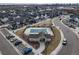 A landscape of the community pool, playground, clubhouse, and parking at 7484 W Atlantic Ln, Denver, CO 80227