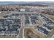 A serene landscape of homes, set against a backdrop of distant mountains at 7484 W Atlantic Ln, Denver, CO 80227