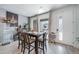 Bright dining room features a stylish table and decor, with a view to the outdoor patio at 7484 W Atlantic Ln, Denver, CO 80227